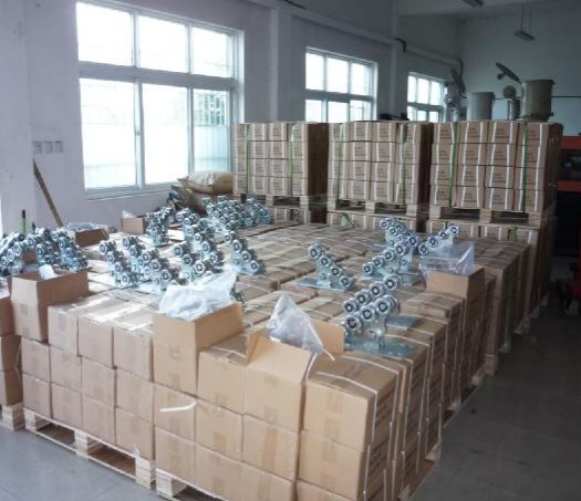 Roller components on a carton on a pallet, with packed cartons behind them